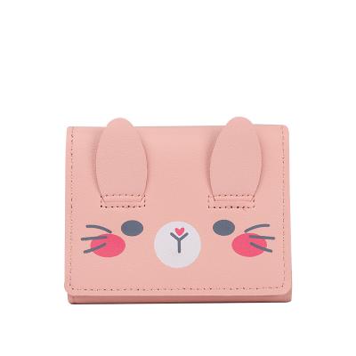 China Female Short Personality Mini Coin Purse Card Holder Cute Paragraph Folding Cartoon 2021 New Waterproof Small Wallet for sale