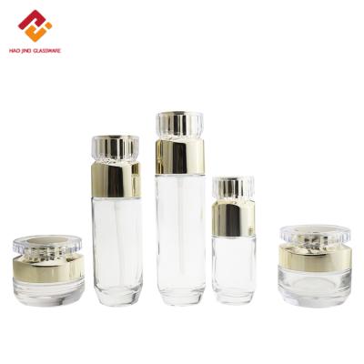 China Recyclable Luxury Cosmetic Packaging Gold Glass Bottle 100Ml 120Ml Empty Skin Care Lotion Bottle Set for sale