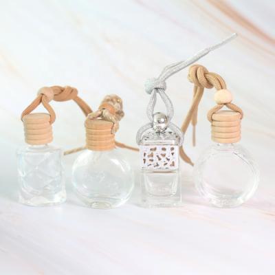 China E-Friendly Custom Mini Car Diffuser Bottle With Wooden Cap 10ml Clear Empty Hanging Perfume Bottle for sale