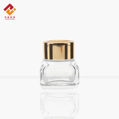 China E-friendly Cosmetic Packaging Container Skin Care Quality Size Clear Glass Cream Jar With Gold Screw-on Lid for sale