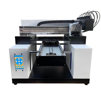 China 2021 New Advertising Company Small Flatbed Digital T-shirt Printing UV Led Printer Hot Melt Powder for sale