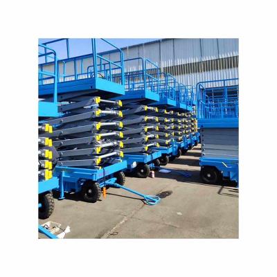 China Hotels Guaranteed Quality Price Suitable Outdoor Electric Wheel Drive Hydraulic Scissor Lift Moving Platform for sale