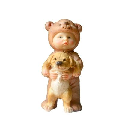 China Z14202A Europe Baby Playing With Dog Statue Resin Gifts Table Decoration Room Wholesale High Quality Ornaments for sale