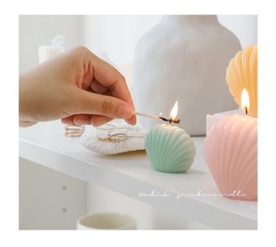 China Smokeless Paraffin Solid Relighting Aromatherapy Essential Oil Candle Shell Gift Decorative Candles for sale