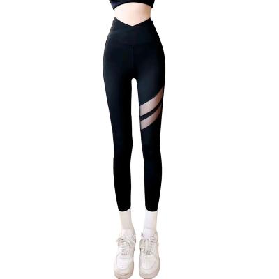 China Hot Selling Breathable Yoga Pants For Women Fitness And Sports Hollow Out High Waist Cross Tight Pants Customized Shark Pants For Gym for sale