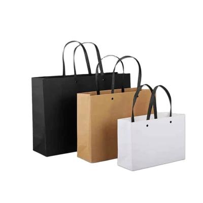 China Recyclable Custom Design Logo Free High End Specialty Paper White Shopping Paper Bag For Clothes for sale