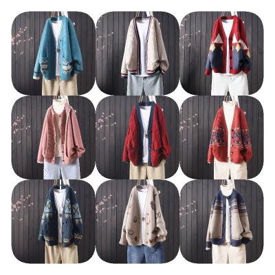 China Anti-wrinkle Cardigans Button Puff Sleeve Checkered Oversized Women's Sweaters Winter for sale