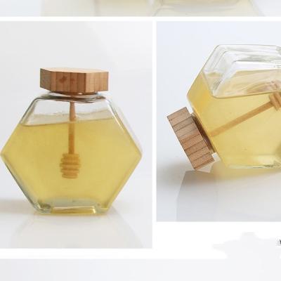 China Wholesale 100ML 220ML 380ML 500G Food Container Glass Jam Jar Custom Hexagon Empty Honey Glass Jar With Wood Lid Dipper for sale