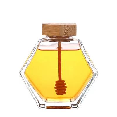 China Hot Sale 100ml 220ml 380ml empty clear hexagonal container Glass jam honey jar jar with wooden spoon and bamboo cork for sale