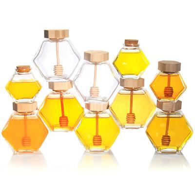 China Wholesale 100ml/220ml/380ml Hexagonal olive wood Honey Jar Glass Food Can With Wooden Lid And Dipper for sale