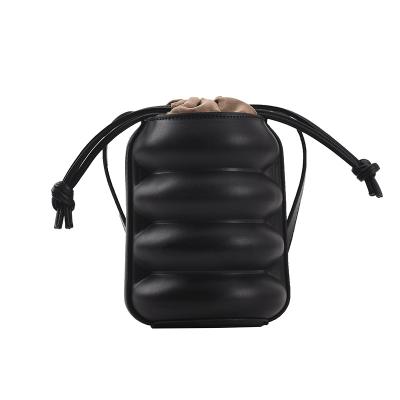 China 2021 new arrival lady padding small PU barrel shape bag with single shoulder and cross-slung with cylinder quilted rope on top for sale