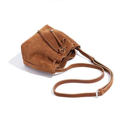 China Fashion Drawstring retro genuine leather bag bow design Korean style bucket bag frosted texture advanced wear-resistant underarm bag New for sale