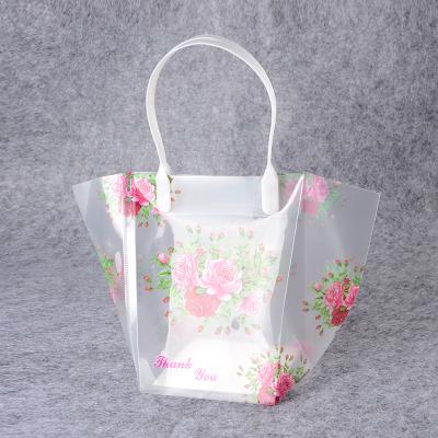 China Fashion Recyclable Wholesale Custom Flower Printing Plastic Portable PVC Gift Packaging Bag for sale