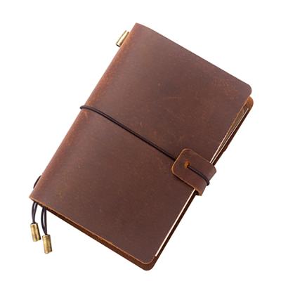 中国 Classic Genuine Leather Handmade Diary Travel Journals Custom A6 Hardcover Notebook Diaries with Elastic Closure 販売のため