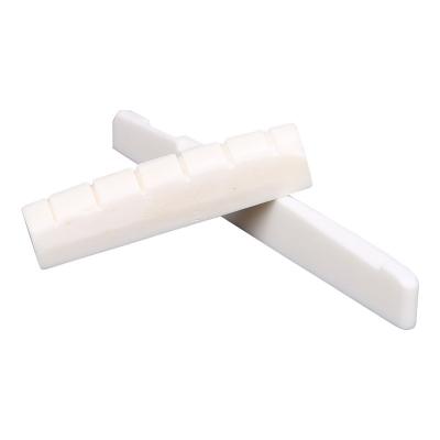 China Cheap Eco-friendly Acoustic Guitar Accessories Ivory And White Bridge Ox Bone Guitar Nut Guitar Saddle for sale