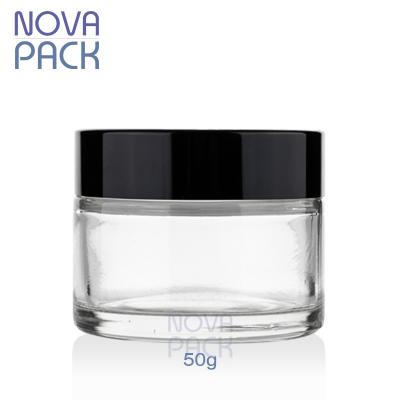 China Skin Care Cosmetic Containers and Clear Glass Jar 50g Facial Cleanser Packaging 25ml 30ml 50ml Round Cosmetic Jar with Black Lids for sale