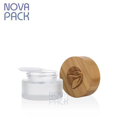 China Cosmetic packaging bamboo cosmetic logo engrave 15g 15ml frosted jar balm container skin care bamboo lid glass jar for facial cream for sale