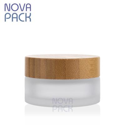 China Hot sale 5g 15g 30g 50g 100g 2oz 4oz cosmetic skin care bamboo packaging frosted wax balm glass bamboo cosmetic facial cream jar for sale