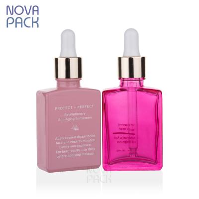 China Square 30ml 50ml 100ml Cosmetic Hair Oil Bottles Square 30ml 50ml 100ml Cosmetic Custom Colored Dropper Bottle Glass Rectangular Gold Red Rose Essential Oil Bottle for sale