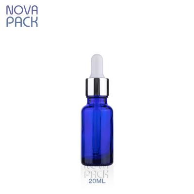 China 20ml 30ml Cosmetic Round Shoulder Pharmacy Dropper Bottle Essential Oil Serum Blue Glass Bottle With Silver Graduated Dropper for sale