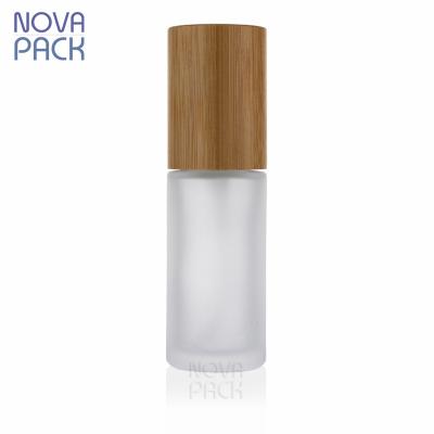 China Cosmetic Packaging 30ml 40ml 50ml 60ml 80ml 100ml Bamboo Cosmetic Skin Care Frosted Glass Bamboo Face Serum Pump Bottle With Bamboo Lid for sale