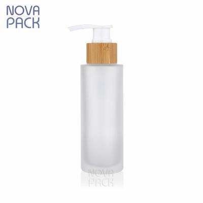 China 100ml Cosmetic Frosted Eco-Friendly Bamboo Wooden Body Lotion Packaging Bottle 4oz Wooden Cosmetic Lotion Pump Bottles Glass Bamboo Bottles for sale