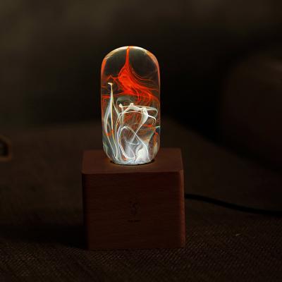 China Creative Transparent LANDSCAPE Aesthetic Resin Table Lamp Atmosphere Ice And Fire Poly Bulb Lighting With Socket for sale