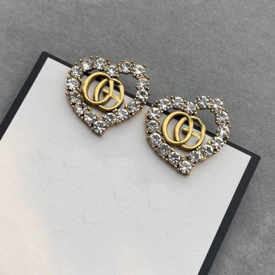 China Trendy Fashion Design Luxury Brand G Love Heart Shape Statement Geometric Crystal Stud Earrings For Women 2022 Bridal Earring for sale