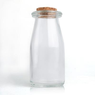 China Wholesale Clear Empty Glass Milk Bottle Milk Bottle With Cap 500ml for sale