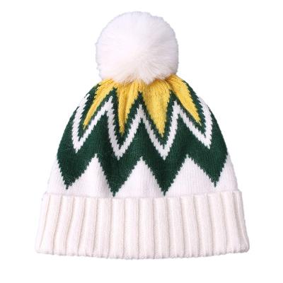 China New Arrival COMMON Women's Fashion Design Pattern Jacquard Winter Warm Hat Pom Ladies Knitted Beanie Pom Pom for sale