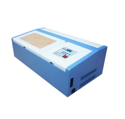 China Laser Engraving 320Laser Engraver Marking Cutting Machines 3020 320 2030 Hot Selling CO2 Shandong Provinces for sale