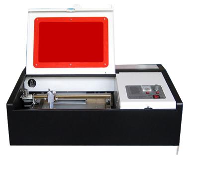 China Liaocheng factory hot sale sj 320 rubber stamp 3020 laser engraving making co2 laser engraving machine 3020 for sale