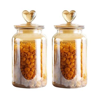 China Freshness Preservation Kitchen Storage Glass Jar Airtight Glass Jar With Heart Shaped Lid Amber Jar for sale