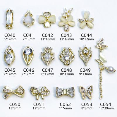 China Wholesale Design Nail Art Decoration 3d Rhinestone Nail Art Charm Glass Bow Tie with Chains Gem Rhinestones Metal Crystal Accessories for sale