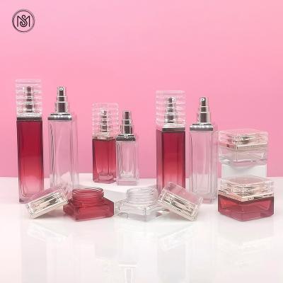 China 30g 50g 40ml 100ml 120ml Cosmetic Skin Care Cosmetic Packaging Set Red Gradient Pump Bottle Serum Clear Square Glass Bottles With Pump for sale