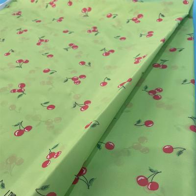 China Sunscreen waterproof fabrics with small cherry patterns are popular in summer for sale