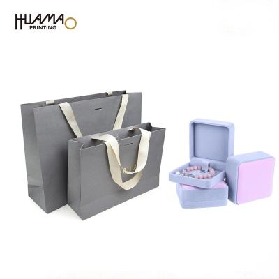 China Recyclable Paper Bag With Ribbon Handle Gold Foil Logo Custom Paper Bag Jewelry Paper Bags for sale