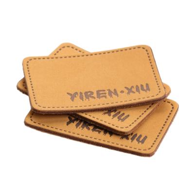 China Viable Custom Logo Pu Leather Patches Jeans Leather Labels For Clothes for sale