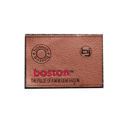 China Factory price washable custom debossed logo sew on real leather labels and washable garment patches for jeans for sale