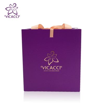 China Custom Cheap Retail Security Rose Gold Stamped Paper Bag Design for sale