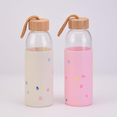 China Viable Bamboo Lid Logo Cute Colorful Silicone Cover Tumblr Transparent Cups Portable Glass Water Bottle for sale