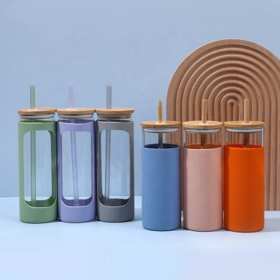 China Eco-Friendly Viable Silicone Transparent Clear Sleeve Bamboo Color Glass Water Bottle With Straw Lid Tumbler for sale