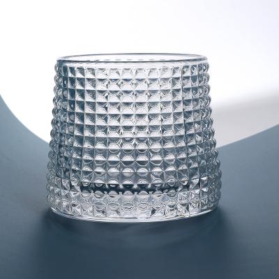 China Soda Lime Glass Viable Transparent Clear Body Irregular Hammer Texture Bottom Spherical Rotating Design Glass Cup for sale