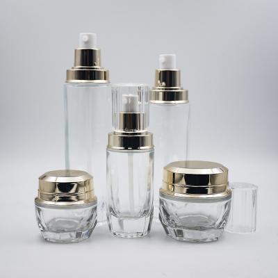 China 15ml 30ml 50ml 80ml 100ml Cosmetic Clear Cosmetic Glass Jar with Gold Cap UV Cream Pump for sale