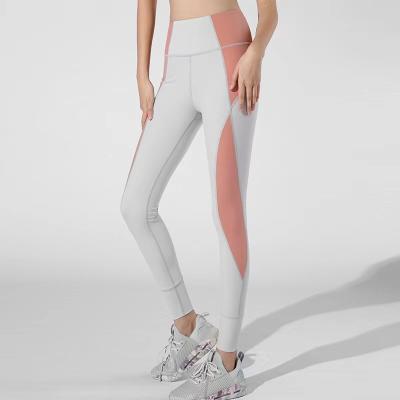 China 2021 New Sports Fitness Yoga Breathable Tight Pants Running Elastic Fishing Quick Dry Hip Lifting Clothes Bare No Embarrassing Line for sale