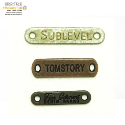 China Viable Permanent Self Adhesive Metal Logo Sticker , Custom Sew On Metal Logo Label for sale