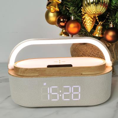 China The 4-in-1 charger, rechargeable lamp, digital alarm clock, speakerphone, night light, bedroom/dining room/desk Amazon best-selling wireless phone holder for sale