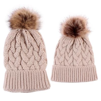 China breathable & YANGTONG Parent-child Hat Fashion Waterproof Winter Beanie Hat With Raccoon Fur Pompom Angora Beanie Hat for sale