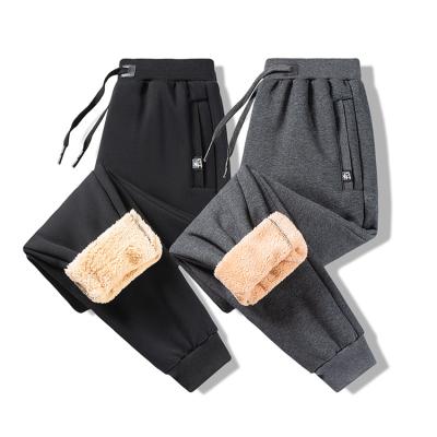 China Anti-wrinkle good quality men's gym drop winter sports loose pants with fleece bound feet casual trousers for sale