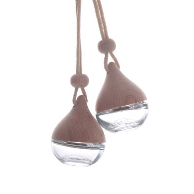 China Popular Spherical Car Air Freshener Diffuser Glass Bottle 7ml Glass Decorative Bottle With String And Cap Wood Cap for sale